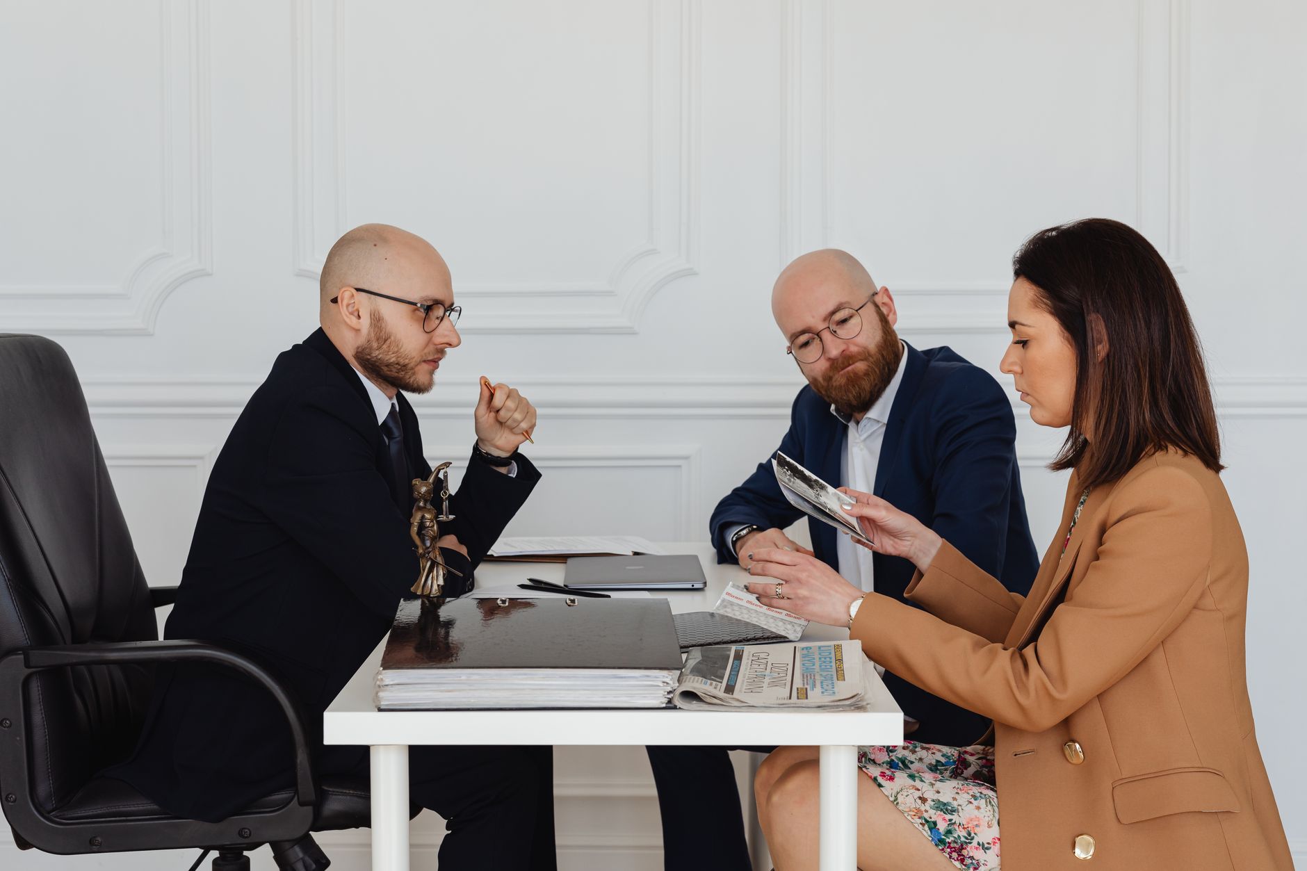 A group of professionals going through documents together